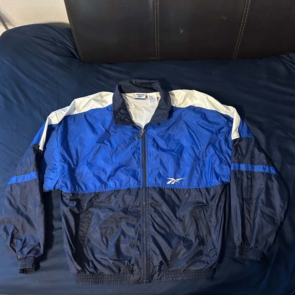 Vintage 90s Reebok Blue Black Windbreaker Jacket Spell Out size small